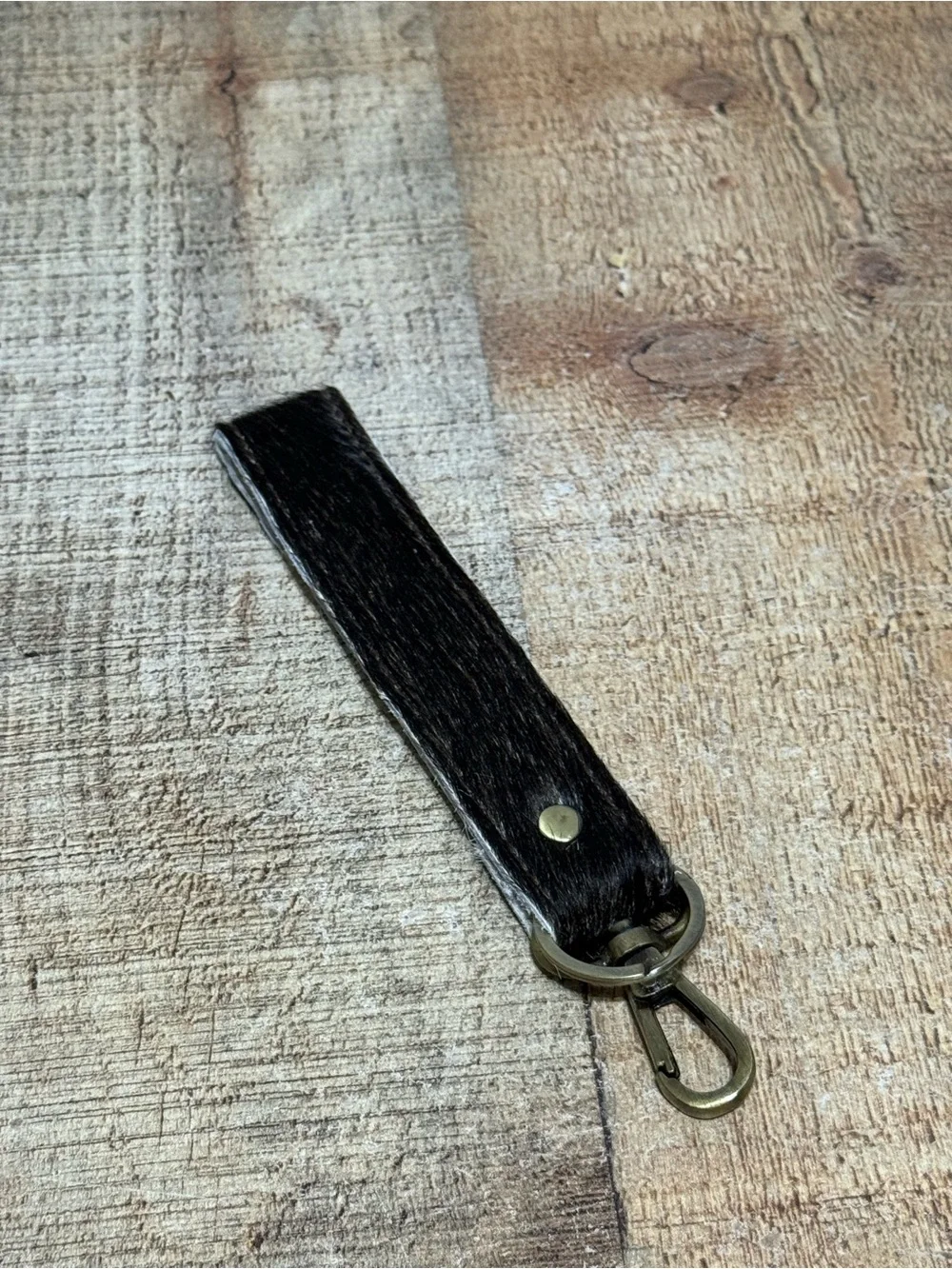 keychain hair-on-hide cowhide strap paired with a brass hook